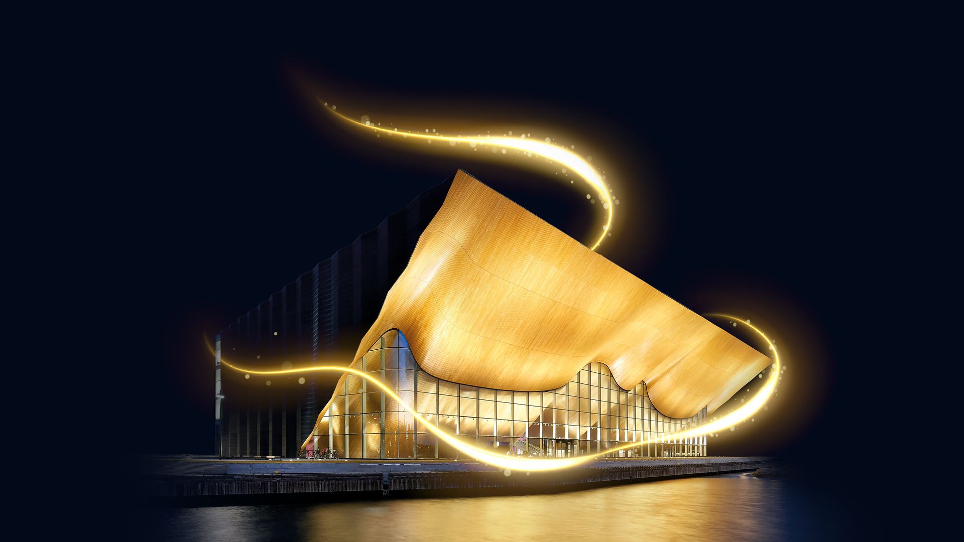 Bilde av Kilden-bygget opplyst i mørket