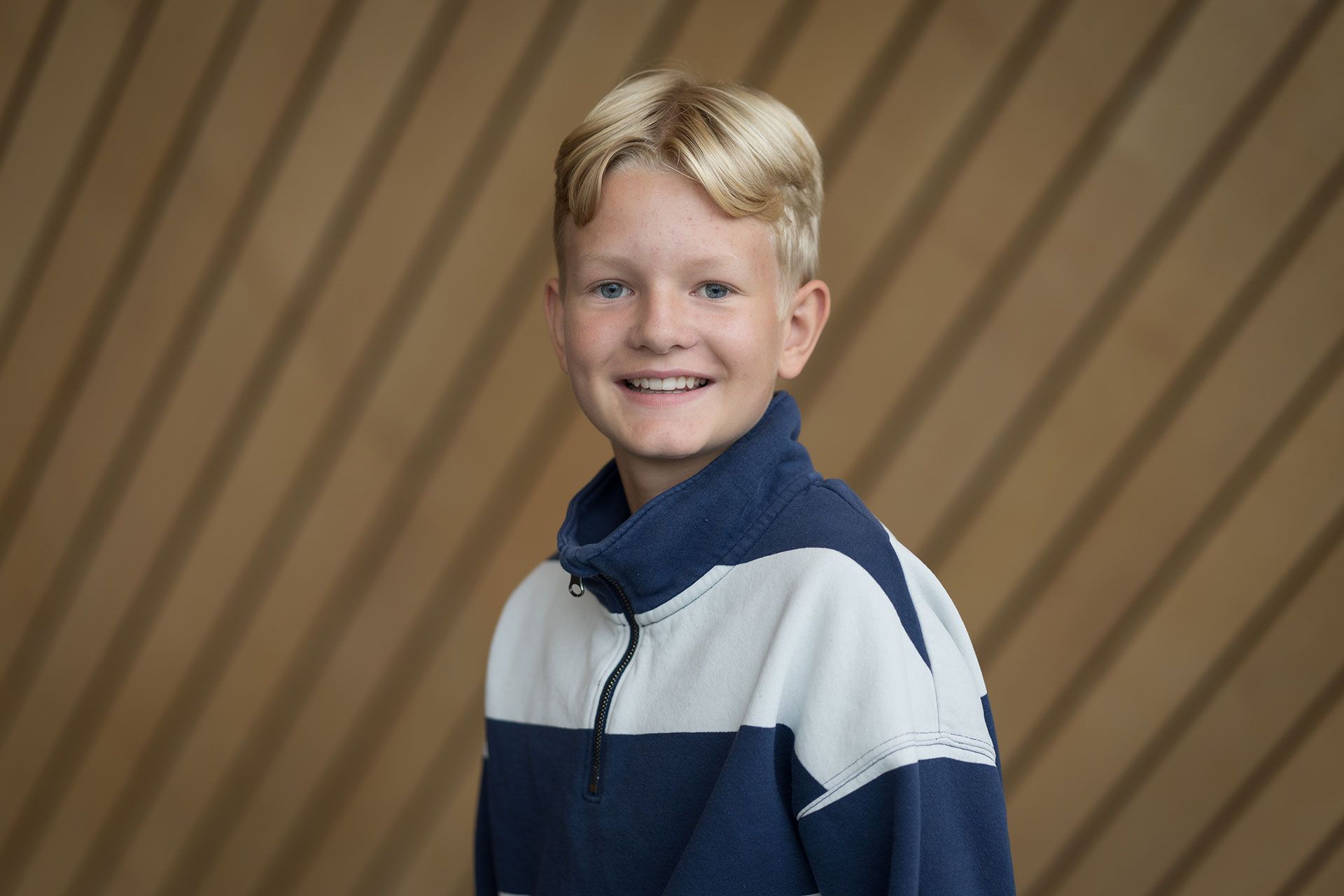 Portrettbilde av Oskar-Amadeus-Høgetveit i Kildens foajé.