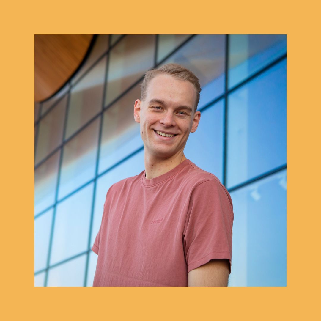 Portrait of Eirik Langås Jørgensen against an orange background.