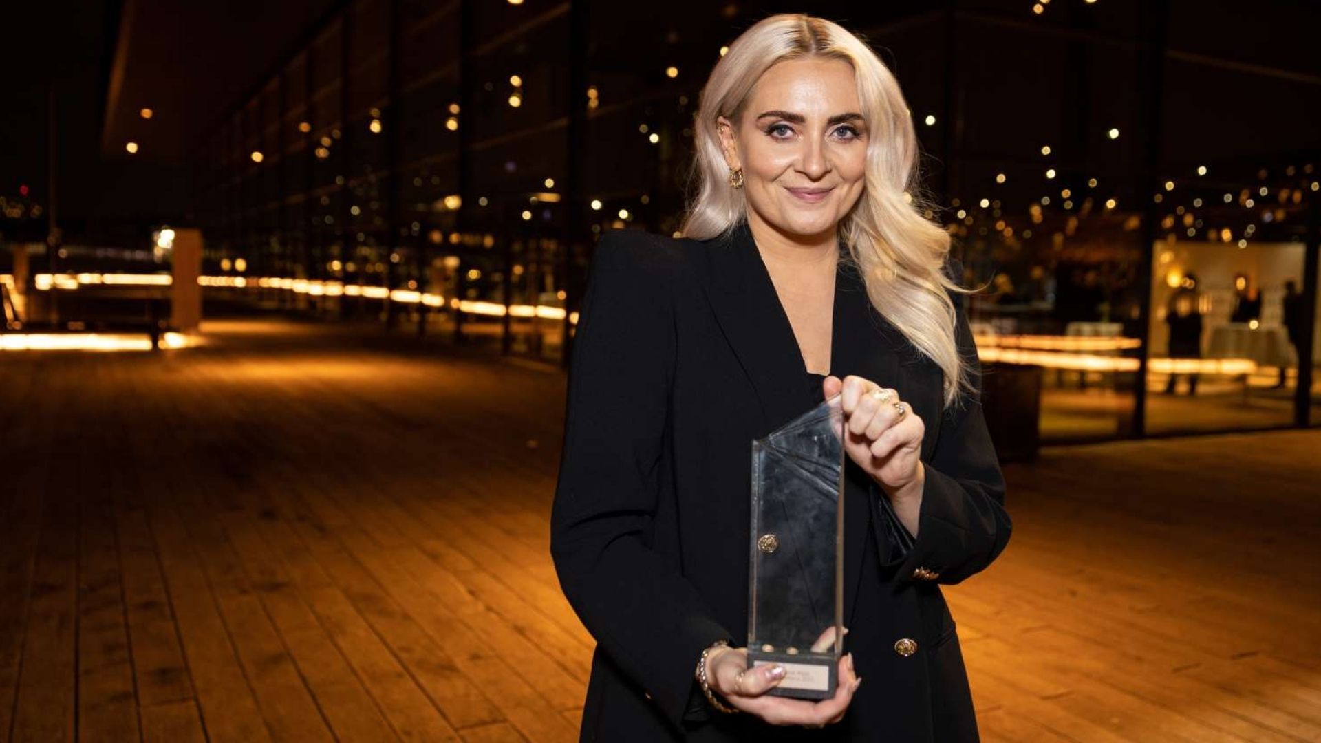 Artist holding an award