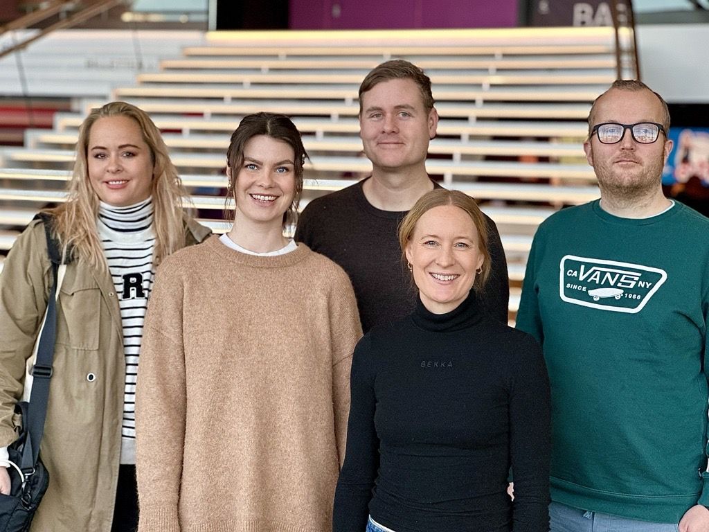 Performing artists in front of a staircase at Kilden